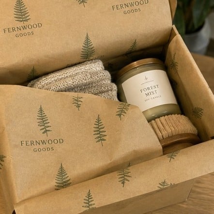 Eco recycled custom tissue paper with soy-ink logo print wrapping a sustainable brand order
