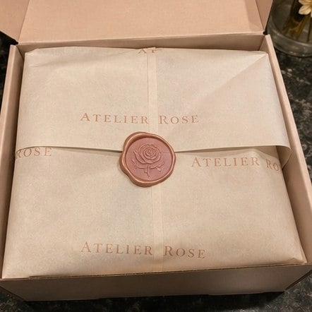 Luxury heavyweight custom tissue paper with satin drape wrapping a premium product